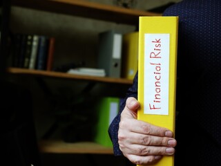 Business concept meaning Financial Risk with sign on the piece of paper.