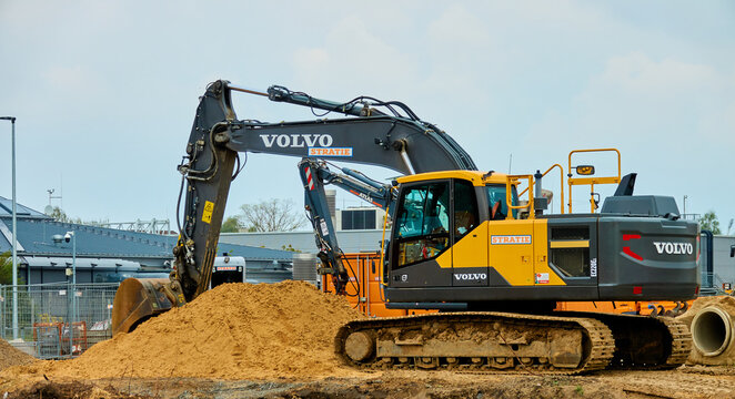 Volvo brand excavator on a pile of sand at the construction site in Braunschweig, Germany, May 2., 2020
