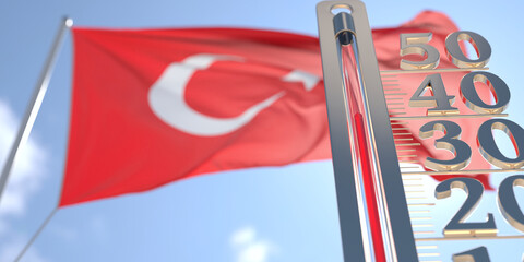 Thermometer shows high air temperature against blurred flag of Turkey. Hot weather forecast related 3D rendering