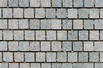 Brickwork from gray bricks in park. Background