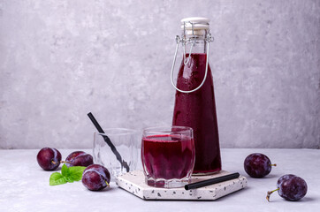 Red plum juice in glass
