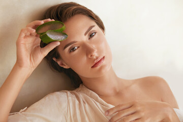 Aloe Vera. Woman Holding Slices Of Leaf And Looking At Camera. Beauty Portrait Of Tender Model With...