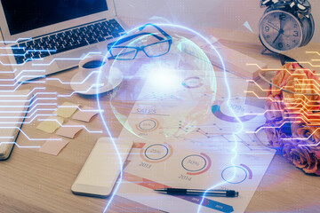 Double exposure of desktop with computer and brain drawing hologram. Artificial intelligence concept.