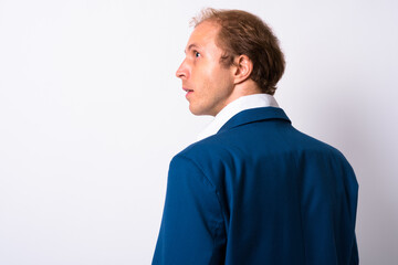 Portrait of businessman with blond hair in suit