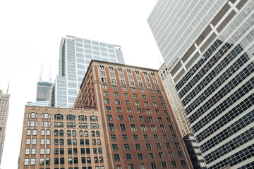 Obraz premium Big buildings in the city on a clear sunny day, career growth