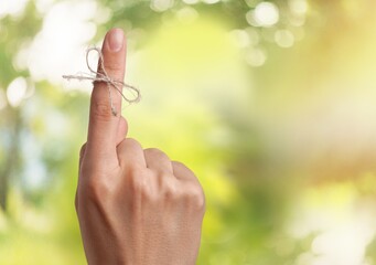 Rope bow on finger pointing up