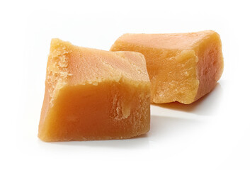 caramel pieces on white background