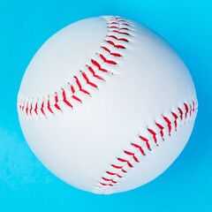 Baseball ball on blue background, close up