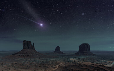 shooting star shining in night sky above monument valley, Utah