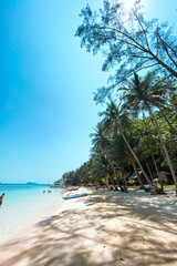 Clear water on the island,Bright blue sea and wooden boat The tourism