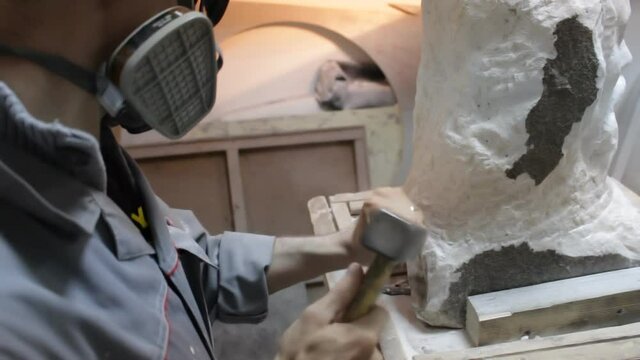 Sculptor Carving On Marble. Working with stone and sculpting statue