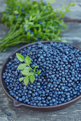 wild blueberries on rustic wooden surface