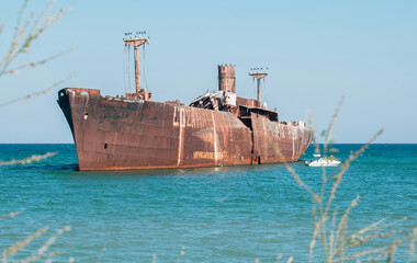 A shipwreck. An old wreck abandoned at sea. The wreck of the ship 