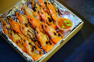 Grilled shrimp (Giant freshwater River prawn) grilling with charcoal at home, Natural Light in the evening. Bangkok, Thailand