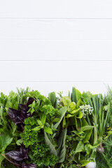 Fresh herbs from the garden on a white background with copy space for text. A large collection of...