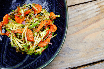 Spicy mango salad a delicious and famous vegetable appetizer from Thailand