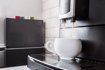 ceramic Cup of coffee Prepared on the coffee machine
