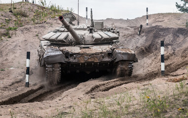 battle tank performs driving exercises for military equipment at the tankodrome