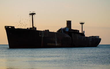A shipwreck. An old wreck abandoned at sea. The wreck of the ship 