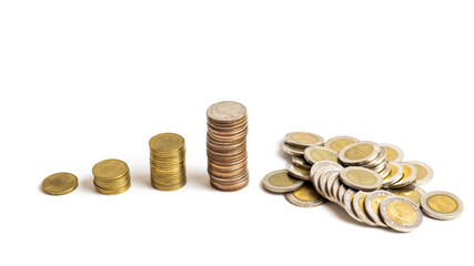A collection of Thai  baht coins on a white background and clipping path. This coin is denominated in Thai baht. Arrange the coins into a bar chart showing business and financial growth.