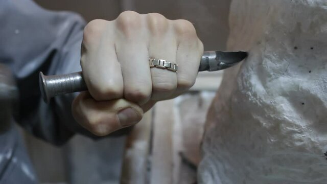 Sculptor Carving On Marble. Working with stone and sculpting statue