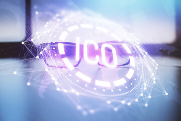 Crypto theme hologram with glasses on the table background. Concept of blockchain. Double exposure.