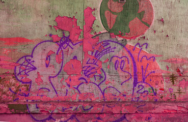 Modern iconic urban culture - tag graffiti letter. Wall decorated with abstract drawings house paint closeup. Detail of tag graffiti. Fragment for background. Modern iconic urban culture street youth