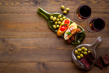 Antipasto and red wine in glasses top-down copy space
