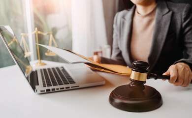 Business and lawyers discussing contract papers with brass scale on desk in office. Law, legal services, advice, justice and law concept
