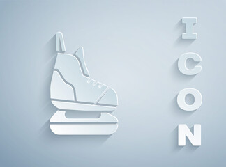 Paper cut Skates icon isolated on grey background. Ice skate shoes icon. Sport boots with blades. Paper art style. Vector Illustration.