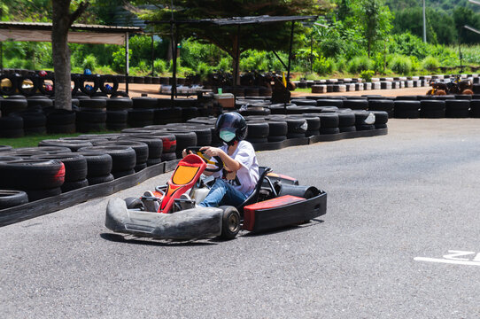 Asian Girls Wearing Mask Driving The Speeding Car