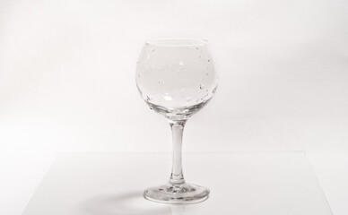 Empty wine glass on glass