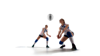 Fototapeta na wymiar Female professional volleyball players in action on white background.