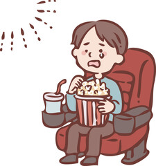 映画を見て感動する男の子