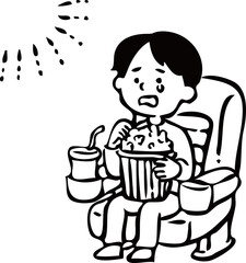 映画を見て感動する男の子