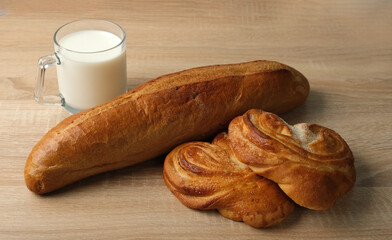 baguette, Moscow buns and milk on the table