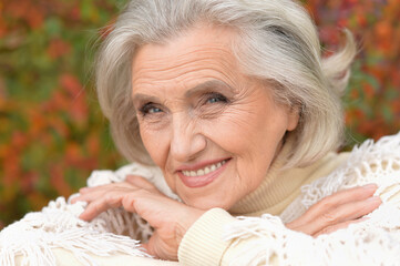 Close-up portrait of happy senior woman posing