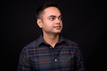Fototapeta premium Portrait of young handsome Indian hipster man