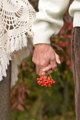 Couple holding hands together on background of park