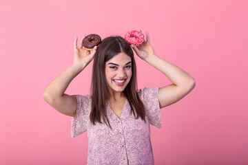 Beauty model girl taking colorful donuts. Funny joyful woman with sweets, dessert. Diet, dieting concept. Junk food, Slimming, weight loss