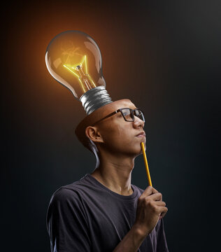 Creative Brain Thinking. Glowing Bulb Inside Man's Head. Photo Manipulation Concept