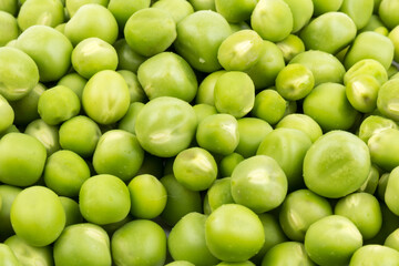 Green young peas, isolated on white background. Close-up. Top view