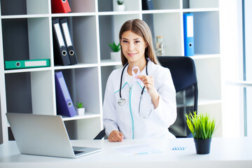 Young female doctor showing purple ribbon as a symbol to awareness LSE or alzheimer awareness symbol
