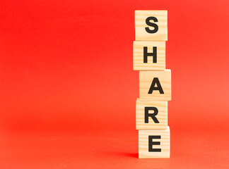 Wooden cubes with letters. For your design, concept. Wooden cubes on a red background. Free space on the left.