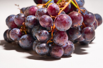 Red grapes on a white background