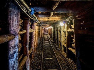 old railway in the tunnel of a mine