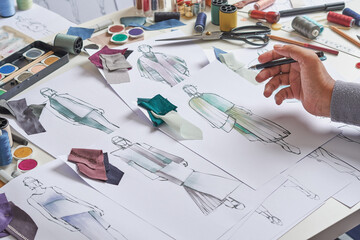 Fashion designer stylish drawings sketches textile fabric material Costume. Designer creative workshop studio.