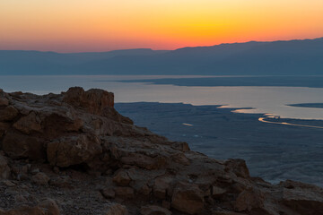 Fototapeta na wymiar Dawn over the mountains of Jordan and the Dead Sea. View from the territory of the ruins of the Massada fortress in Israel.