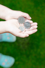 image of children hand coin 