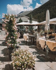 outdoor restaurant decorated with flowers